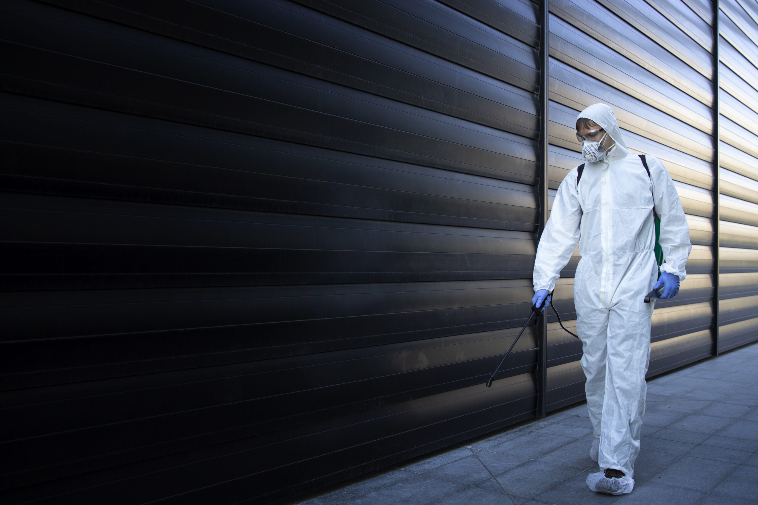Commercial building being sprayed for pests